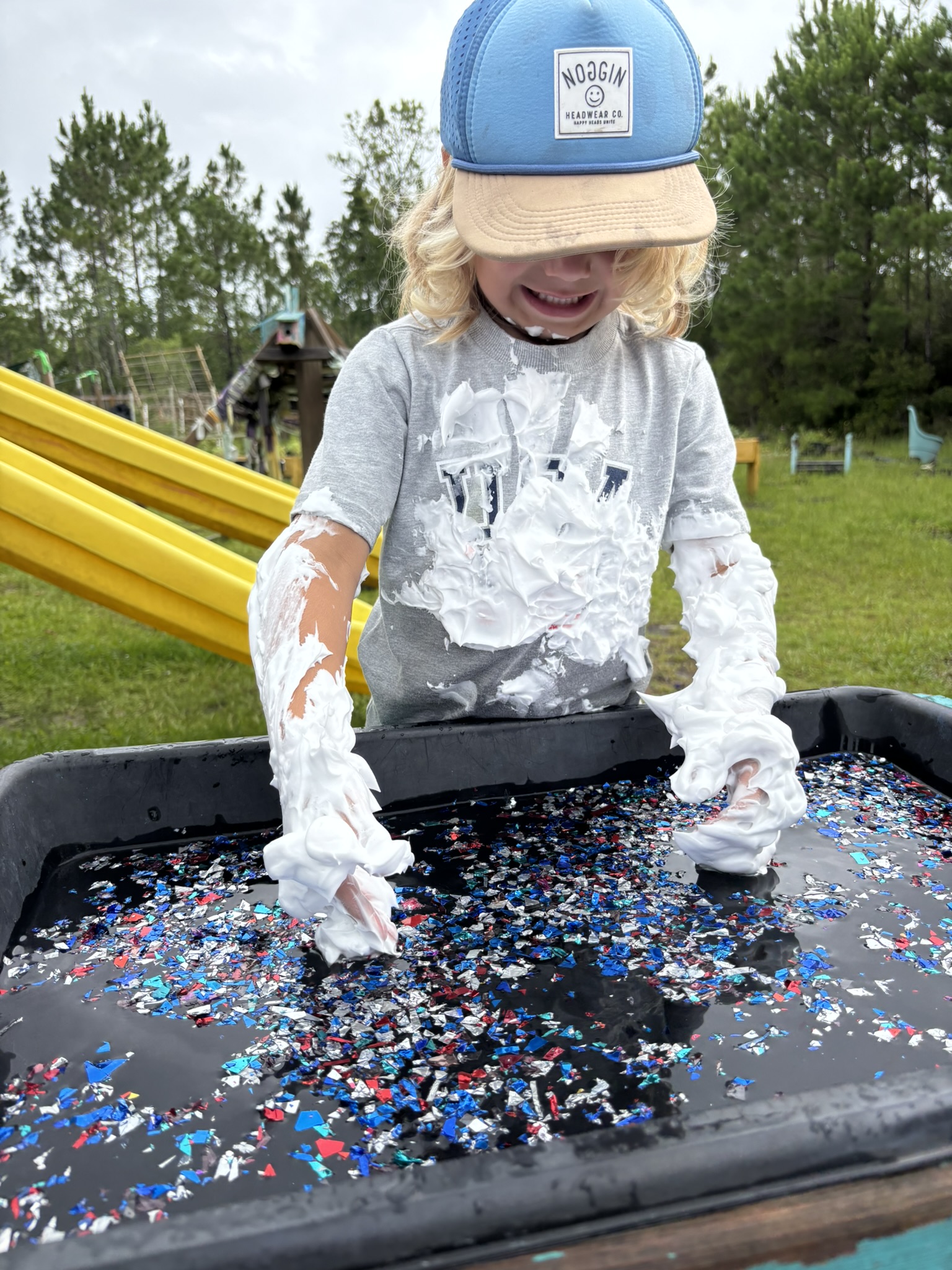 Children learning outdoors at HOK Preschool